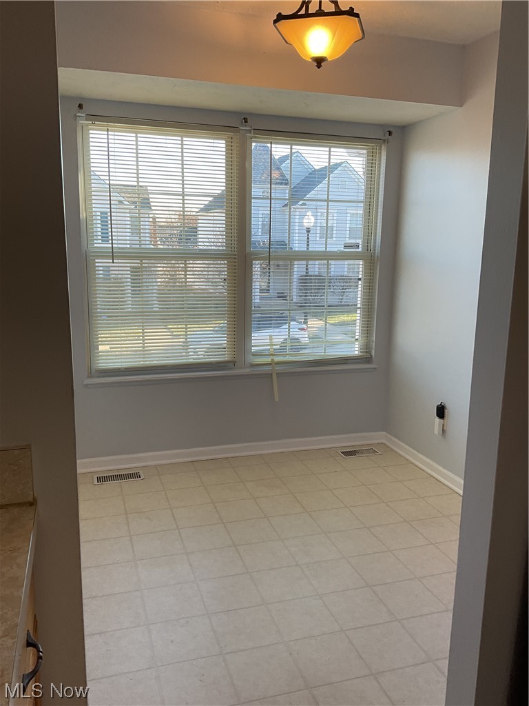 4422 Sexton Road Cleveland, OH 44105 - Photo 11 of 30 Unfurnished room featuring plenty of natural light and light tile floors