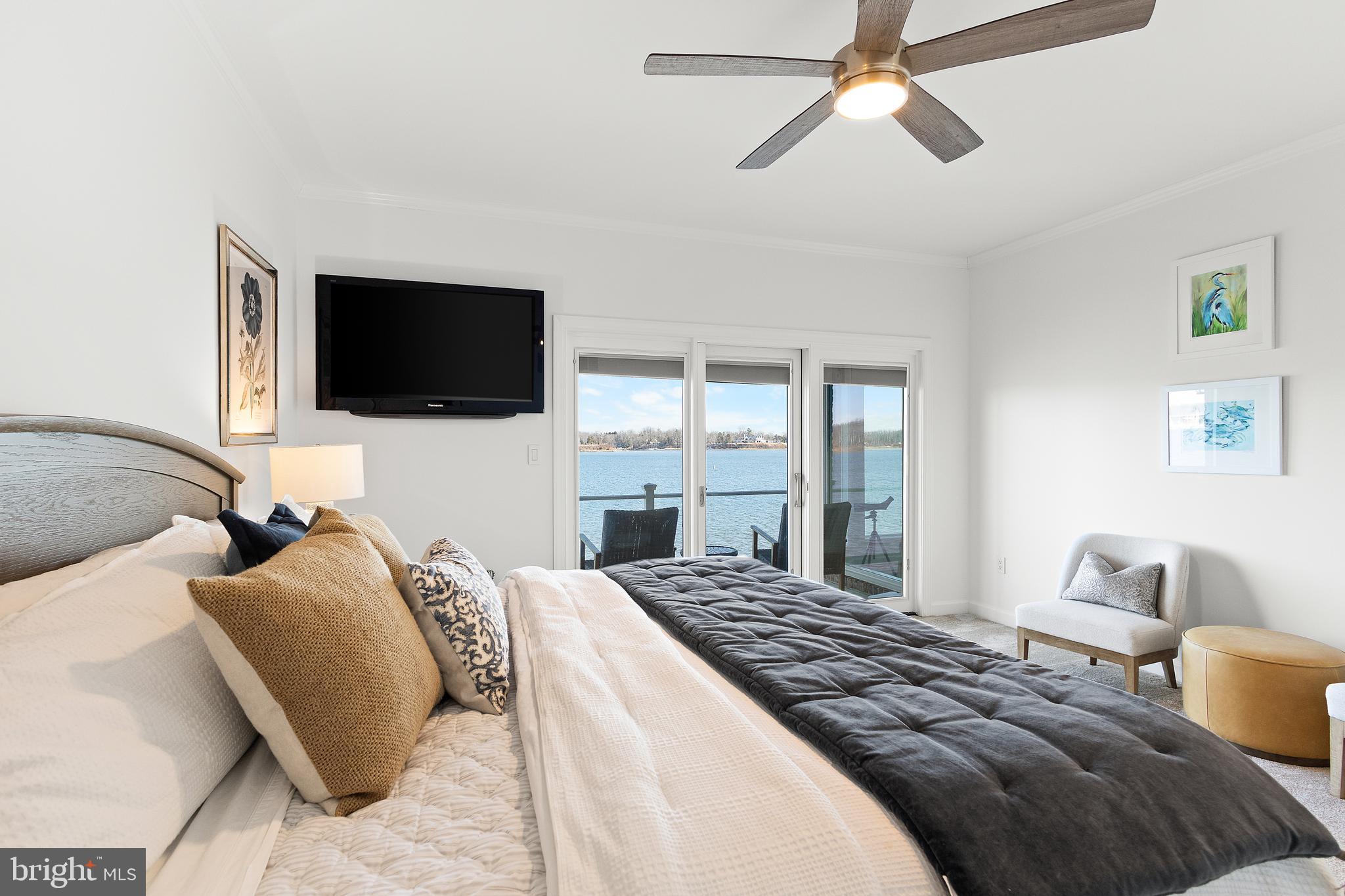 610 South River Landing Road Edgewater, MD 21037 - Photo 18 of 39 a bedroom with a bed and a flat screen tv