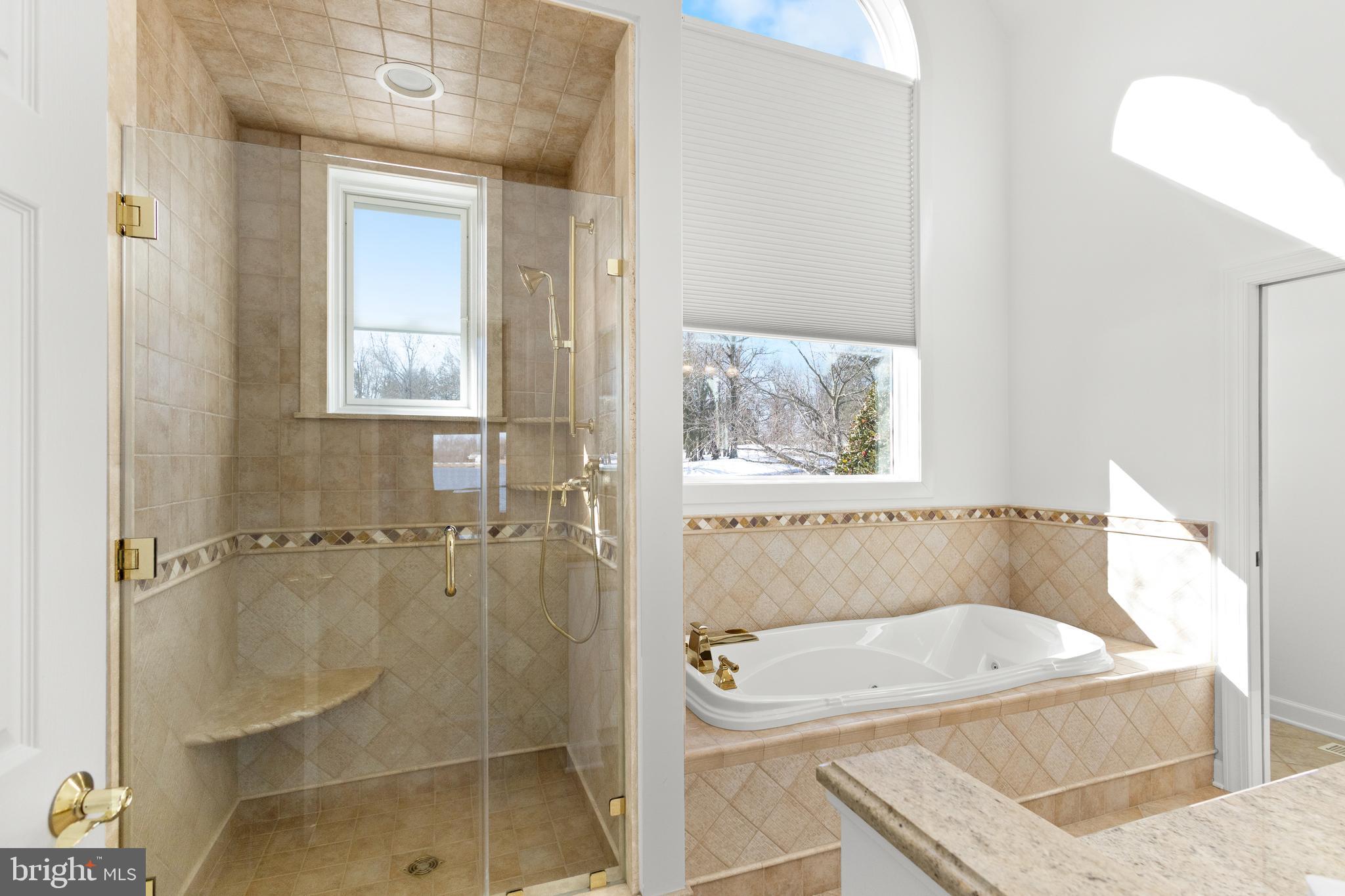 610 South River Landing Road Edgewater, MD 21037 - Photo 19 of 39 a bathroom with a tub a sink and a window