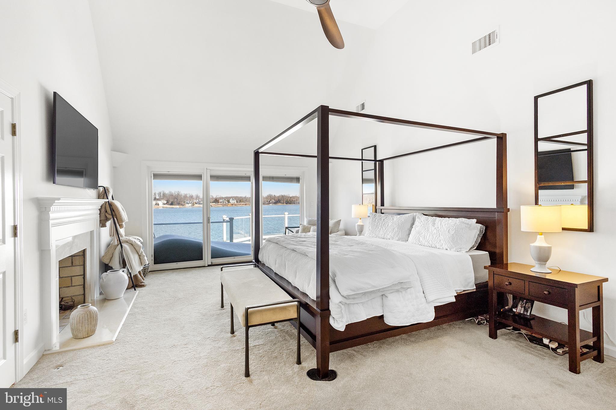 610 South River Landing Road Edgewater, MD 21037 - Photo 22 of 39 a bedroom with a bed and a flat screen tv