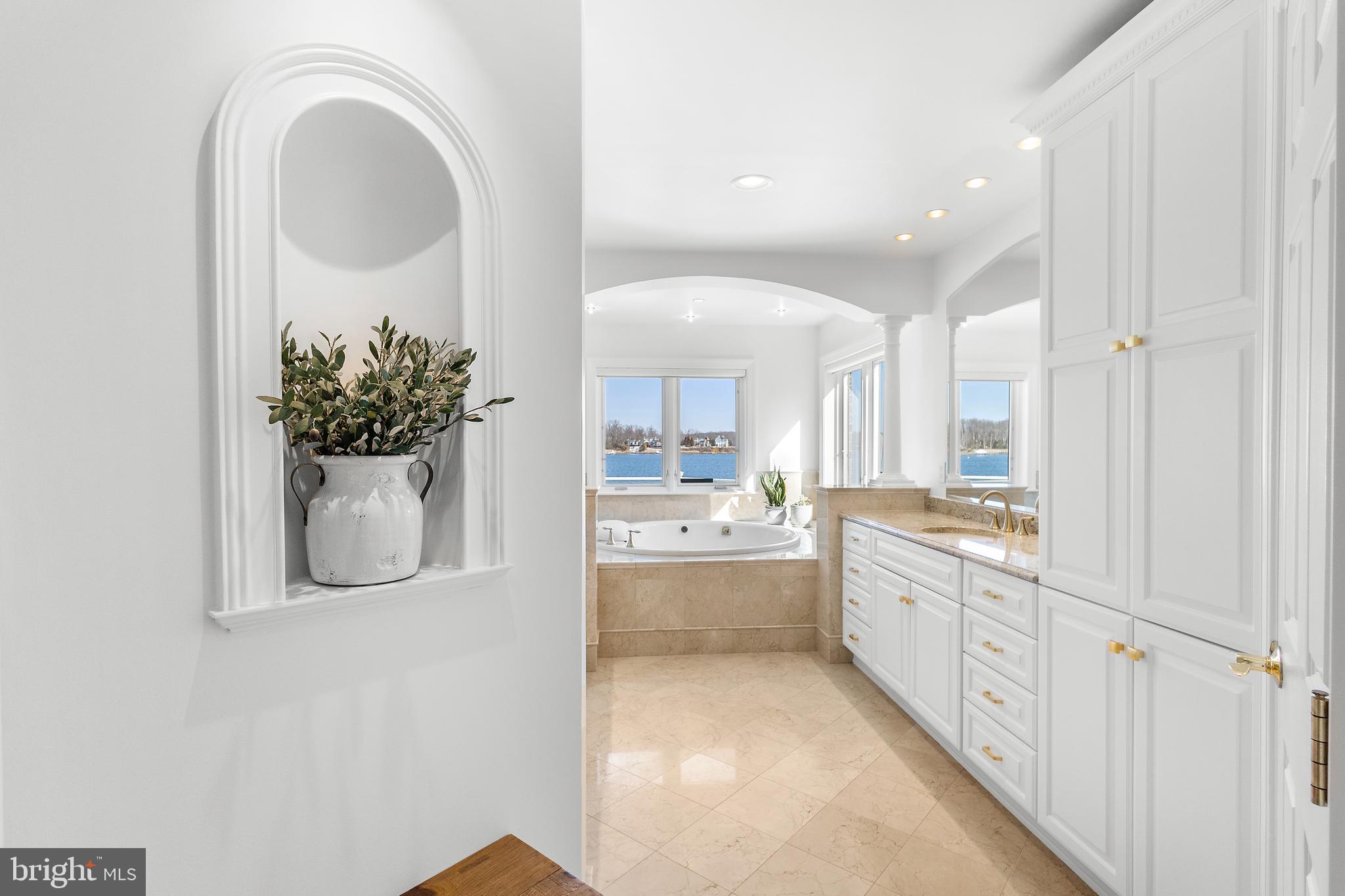 610 South River Landing Road Edgewater, MD 21037 - Photo 25 of 39 a large bathroom with a sink mirror and vanity