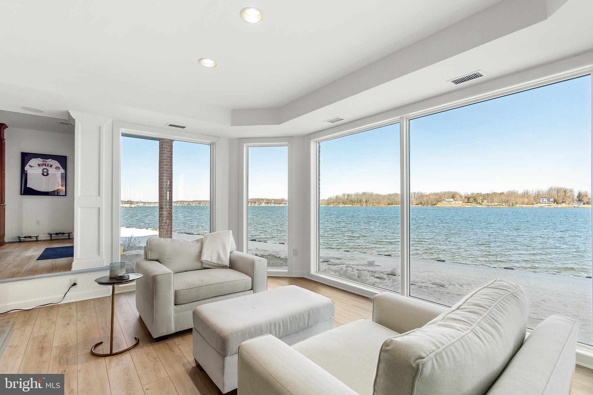 610 South River Landing Road Edgewater, MD 21037 - Photo 30 of 39 a living room with furniture and a floor to ceiling window