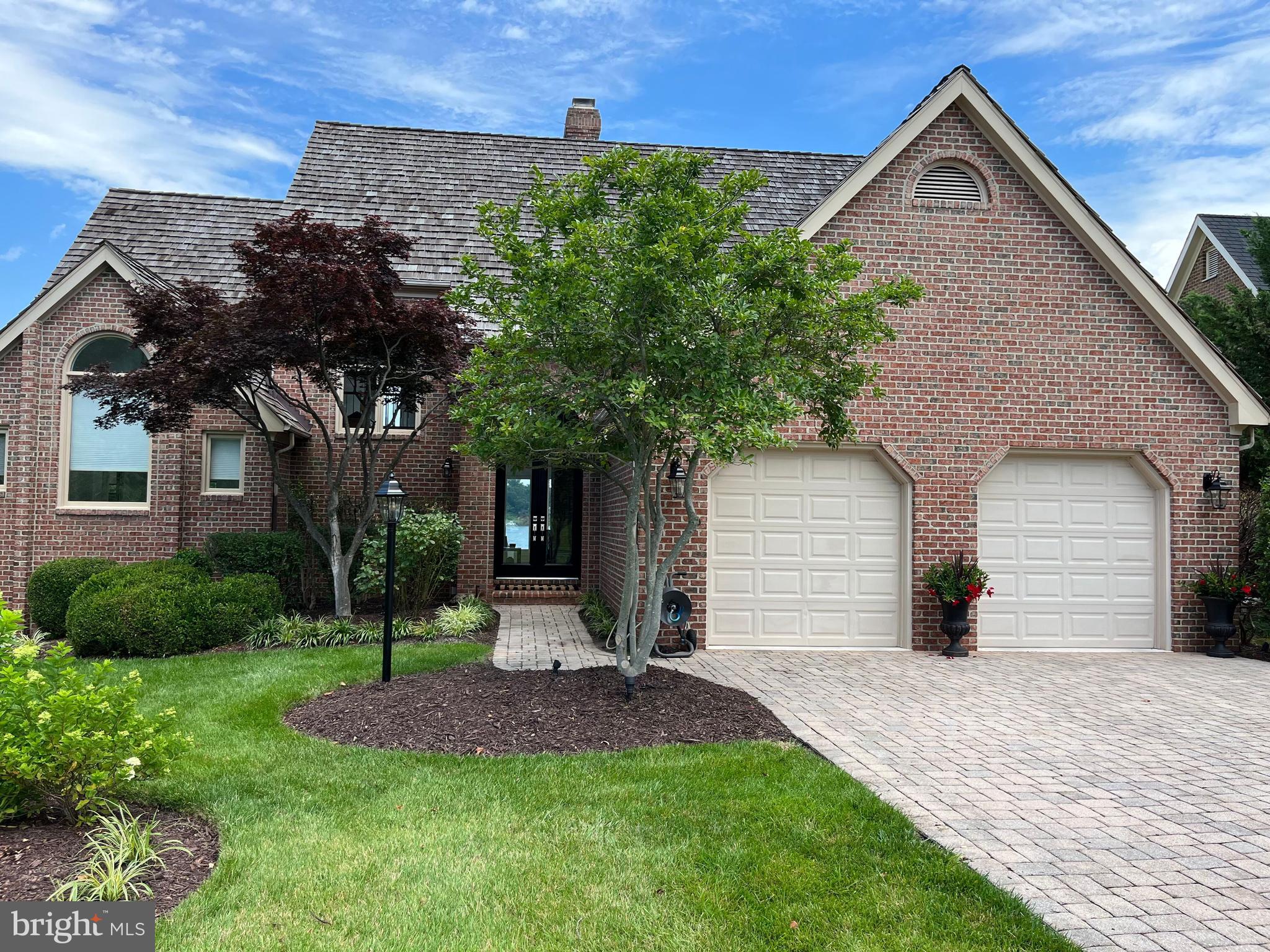 610 South River Landing Road Edgewater, MD 21037 - Photo 3 of 39 a front view of a house with a yard and garage