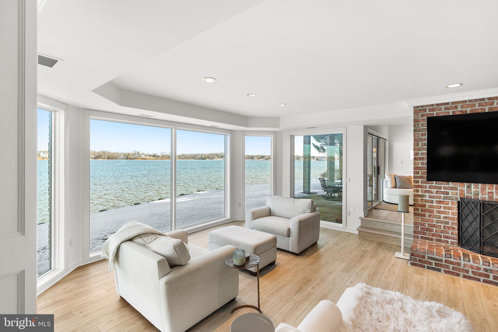 610 South River Landing Road Edgewater, MD 21037 - Photo 31 of 39 a living room with fireplace furniture and a flat screen tv