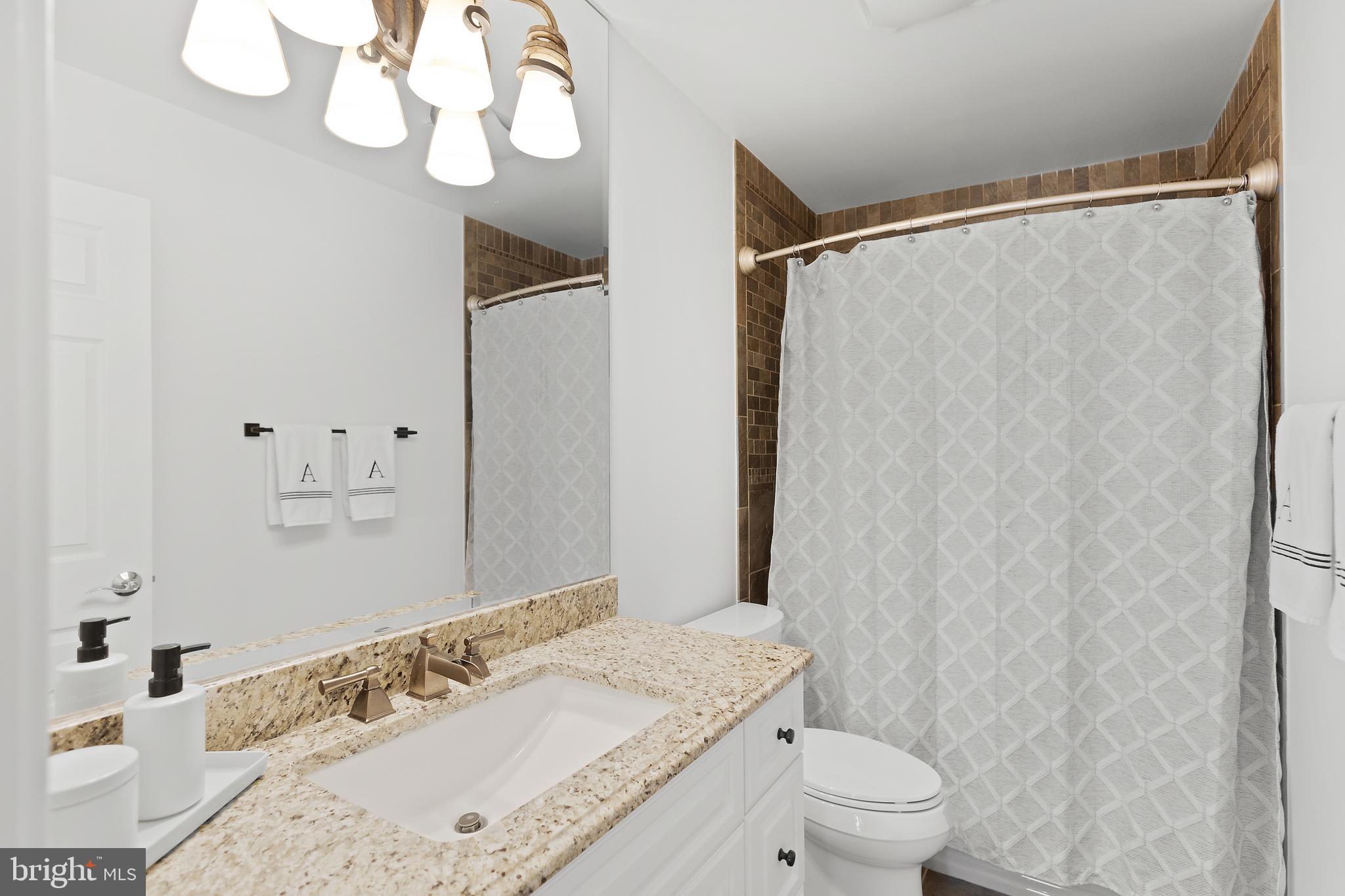 610 South River Landing Road Edgewater, MD 21037 - Photo 34 of 39 a bathroom with a sink and a mirror