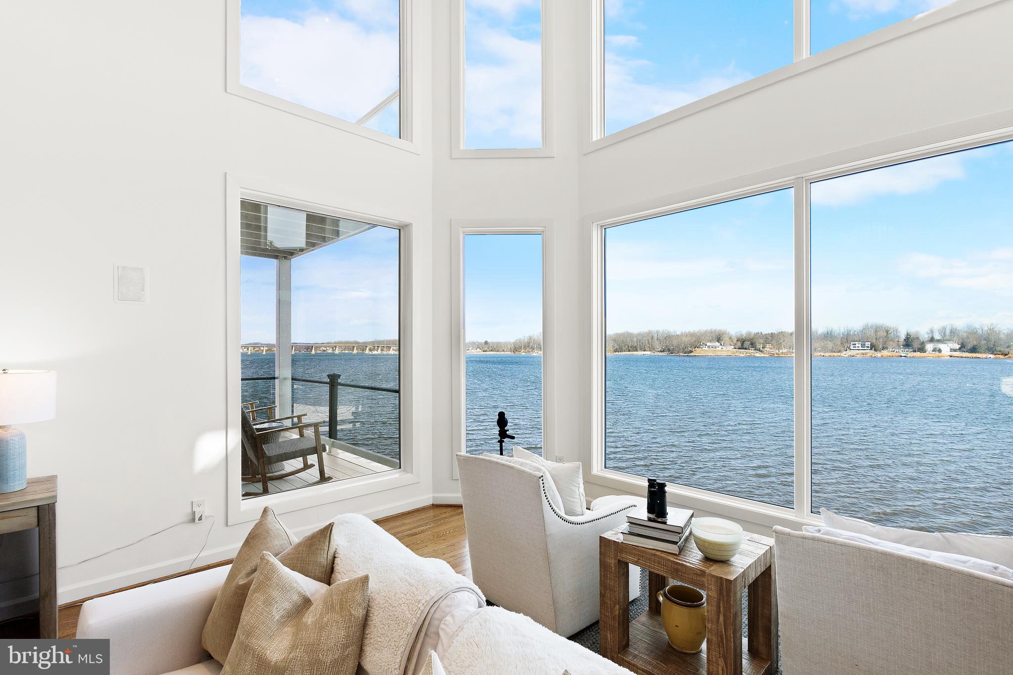 610 South River Landing Road Edgewater, MD 21037 - Photo 7 of 39 a living room with furniture stove and floor to ceiling window