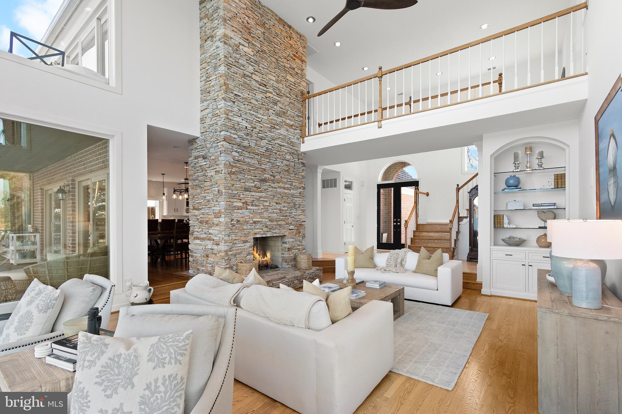 610 South River Landing Road Edgewater, MD 21037 - Photo 9 of 39 a living room with furniture and a fireplace