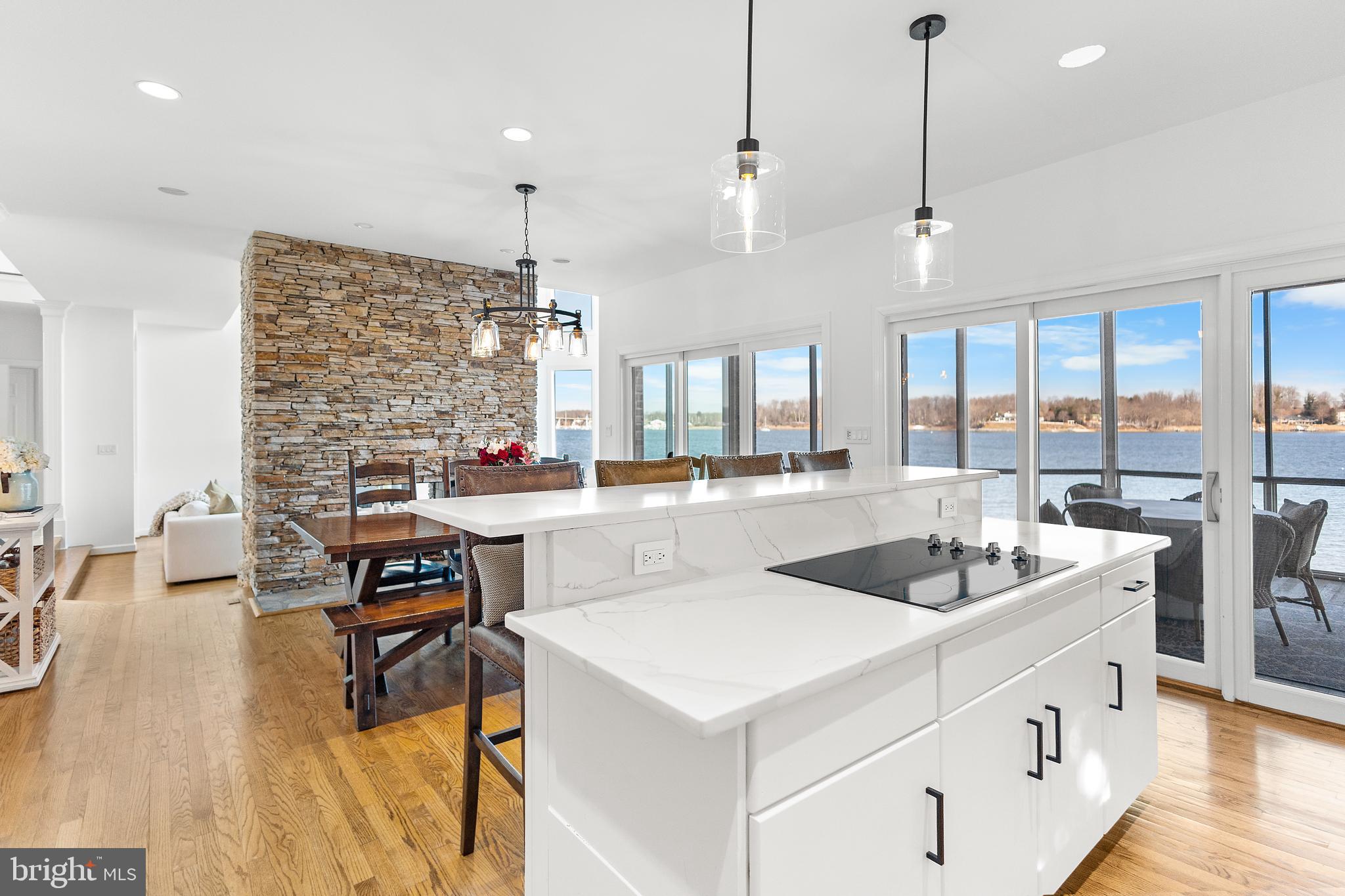 610 South River Landing Road Edgewater, MD 21037 - Photo 10 of 39 a very nice looking dining room with a large center island and couches