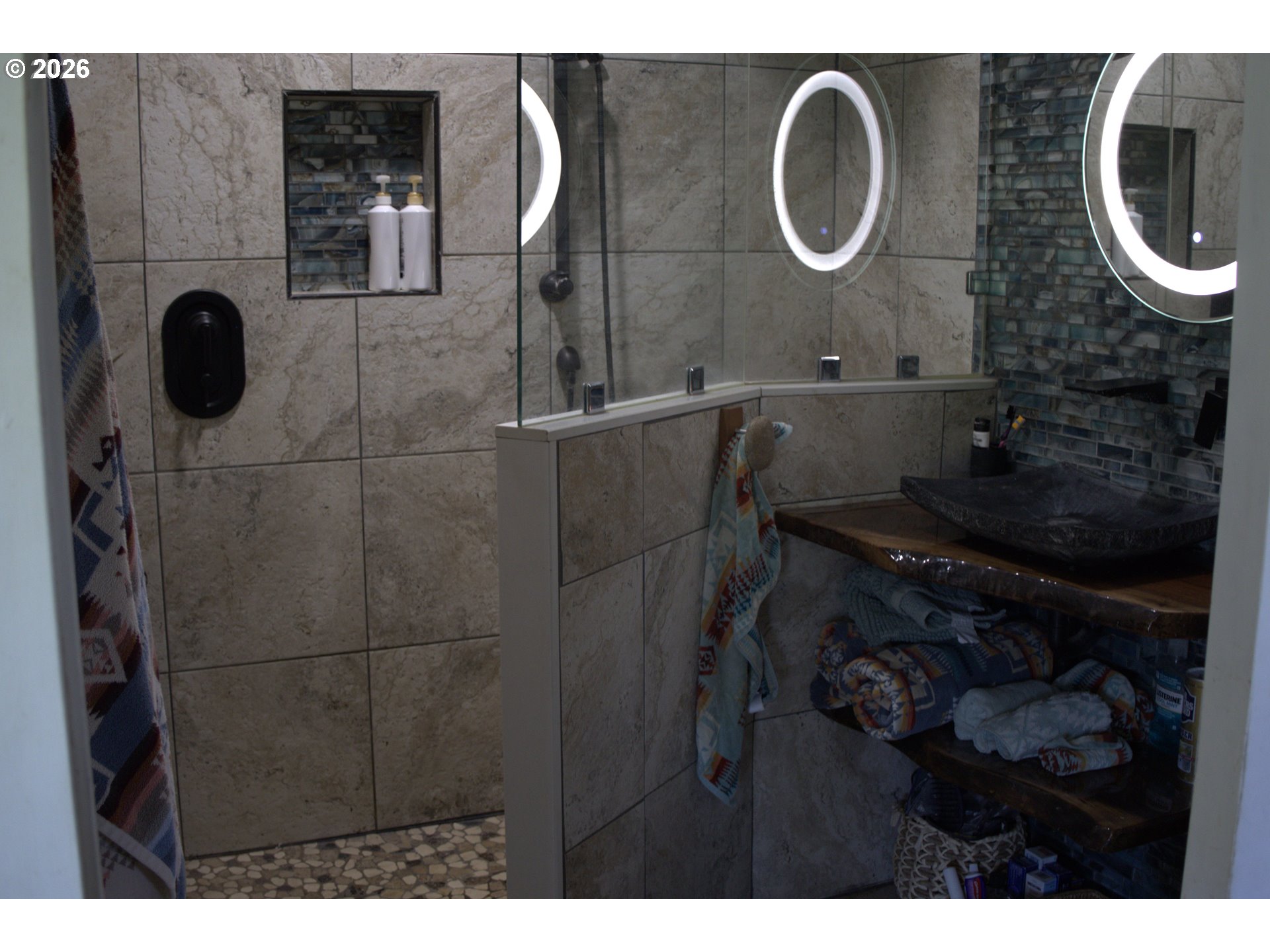 55821 Wildhorse Road Weston, OR 97886 - Photo 20 of 33 a bathroom with a mirror and a sink