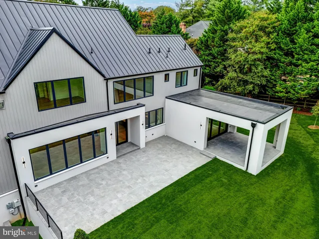a view of a livingroom with wooden floor and windows