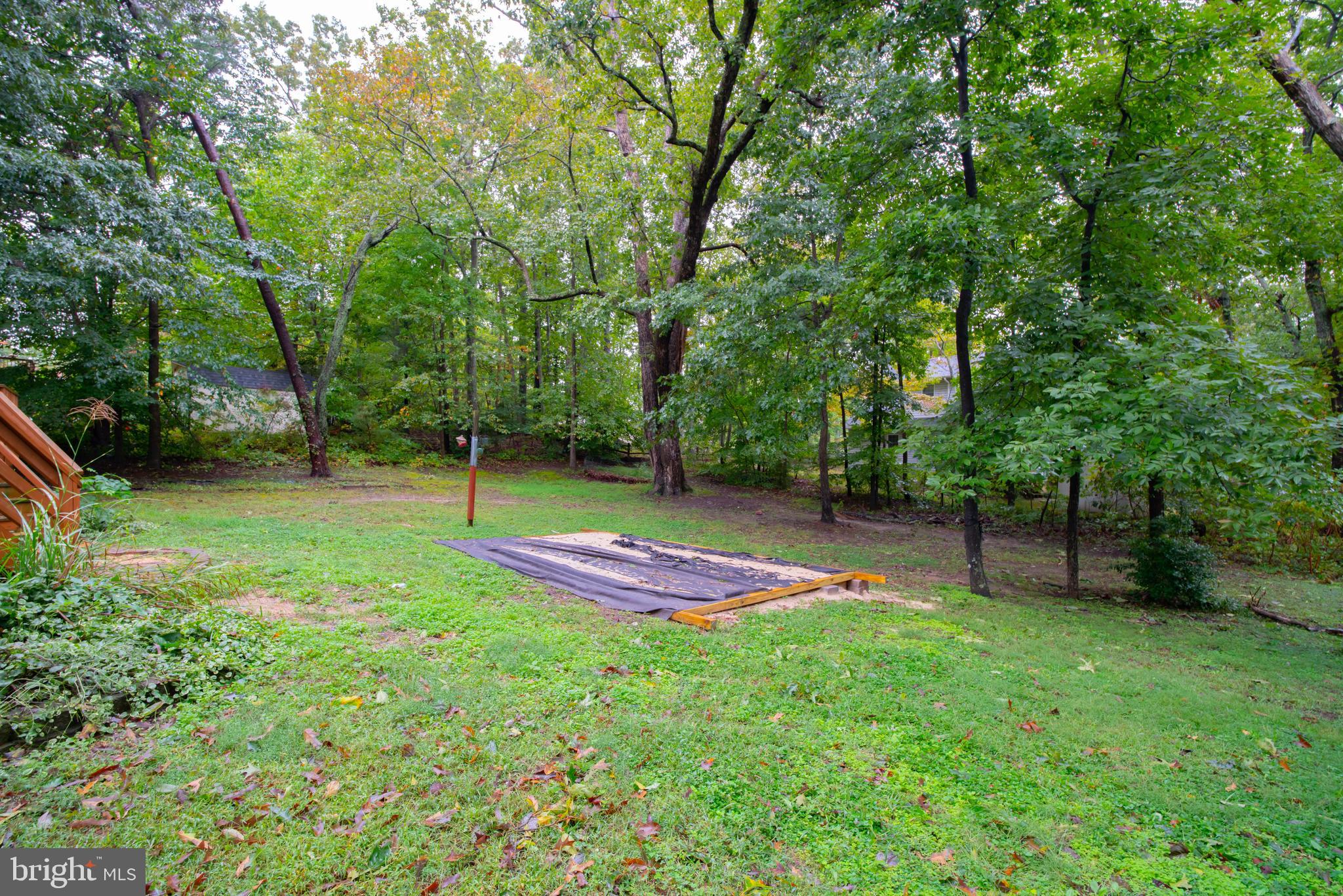 11431 Rawhide Road Lusby, MD 20657 - Photo 31 of 31 a view of green field with trees in the background
