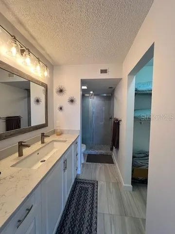 a bathroom with a shower and a toilet