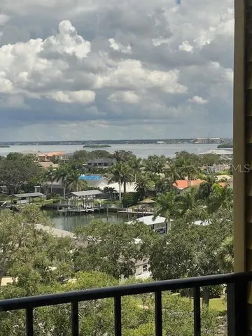 a bedroom with a large bed and a tv