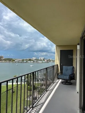 a view of a balcony with an ocean view
