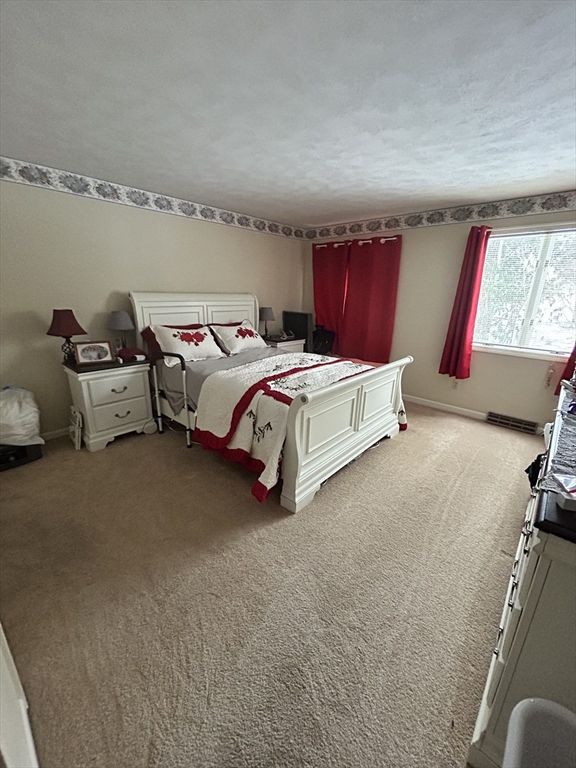 2205 Boston Road, Unit E43 Wilbraham, MA 01095 - Photo 11 of 22 a bed room with a bed and a window