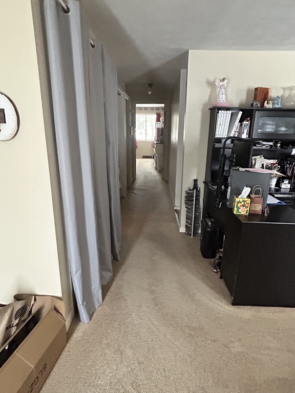 2205 Boston Road, Unit E43 Wilbraham, MA 01095 - Photo 3 of 22 a view of a hallway with workspace and bedroom