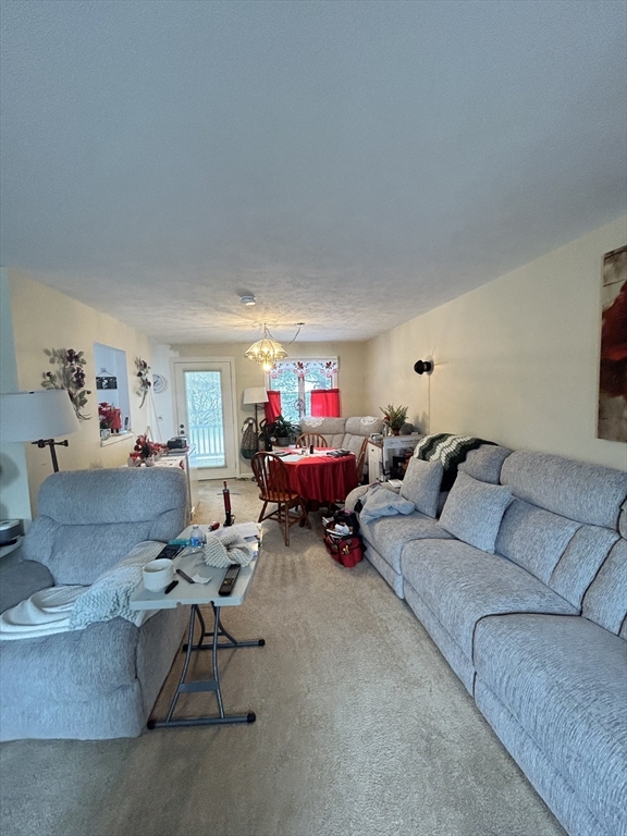 2205 Boston Road, Unit E43 Wilbraham, MA 01095 - Photo 7 of 22 a living room with furniture and a couch