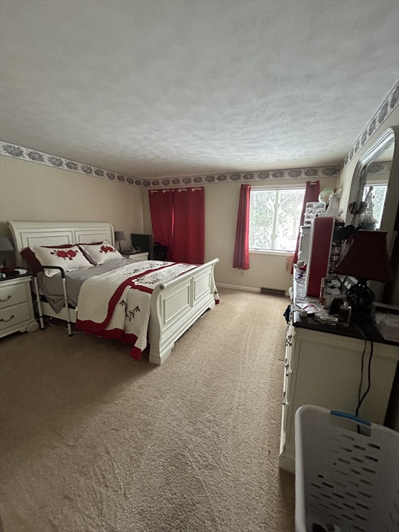 2205 Boston Road, Unit E43 Wilbraham, MA 01095 - Photo 10 of 22 a bed room with furniture and a window