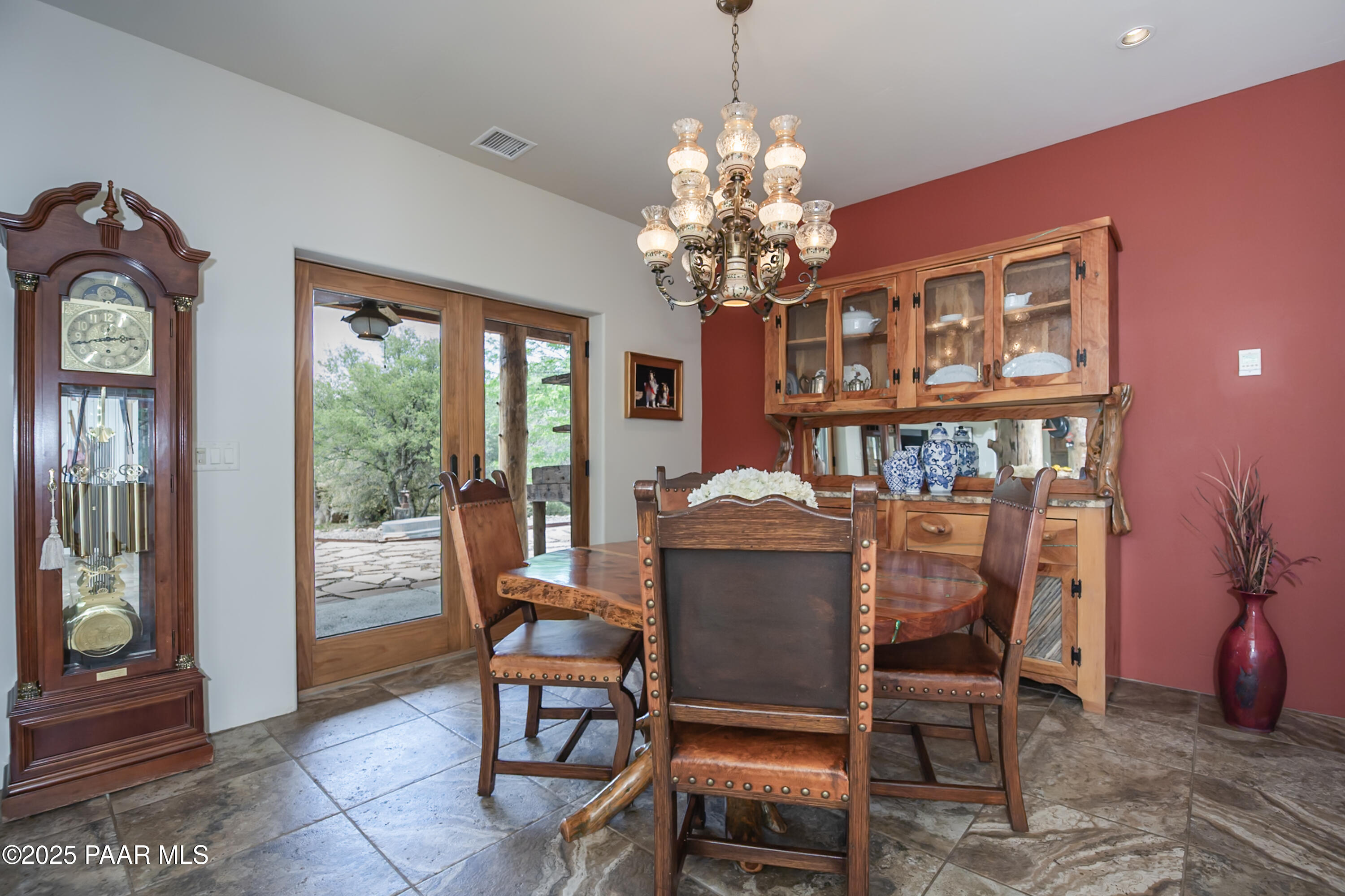 770 Grisby Road Skull Valley, AZ 86338 - Photo 13 of 58 a dining room with furniture a chandelier and window