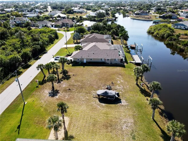 a aerial view of a house with a lake view