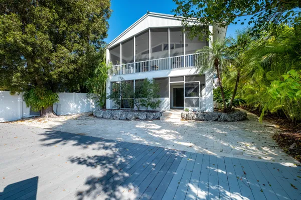 a view of a room with a window and plants