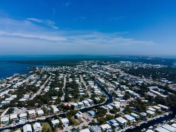 a view of house with outdoor space and sitting area
