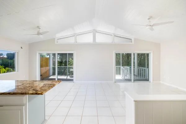 a large white kitchen with cabinets and a stainless steel appliances