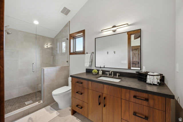7885 North Rabbitbrush Court, Unit 13 Park City, UT 84098 - Photo 63 of 88 Wood-finish vanity with dark countertop and undermount sink