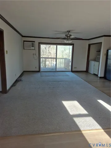 a view of an empty room with a window