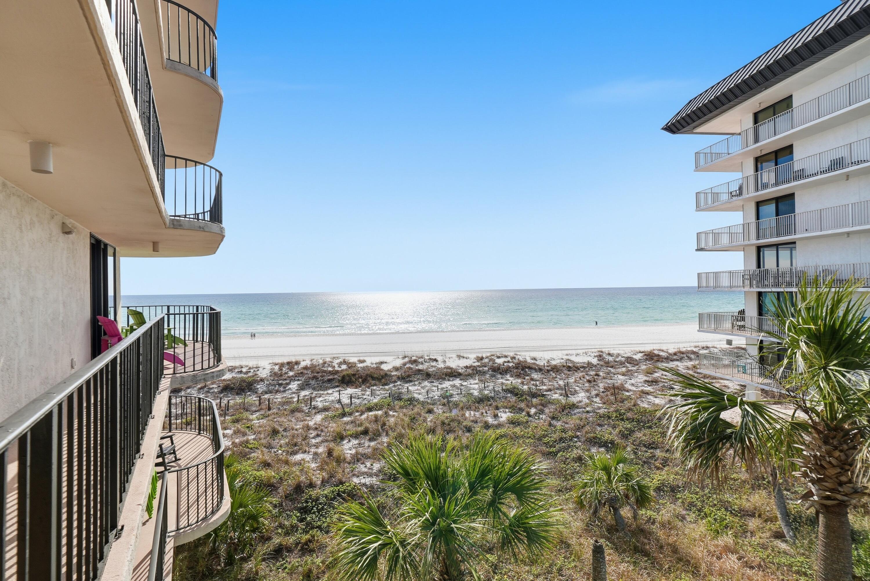 11619 Front Beach Road, Unit 212 Panama City Beach, FL 32407 - Photo 20 of 63 a view of a livingroom with wooden floor and stairs