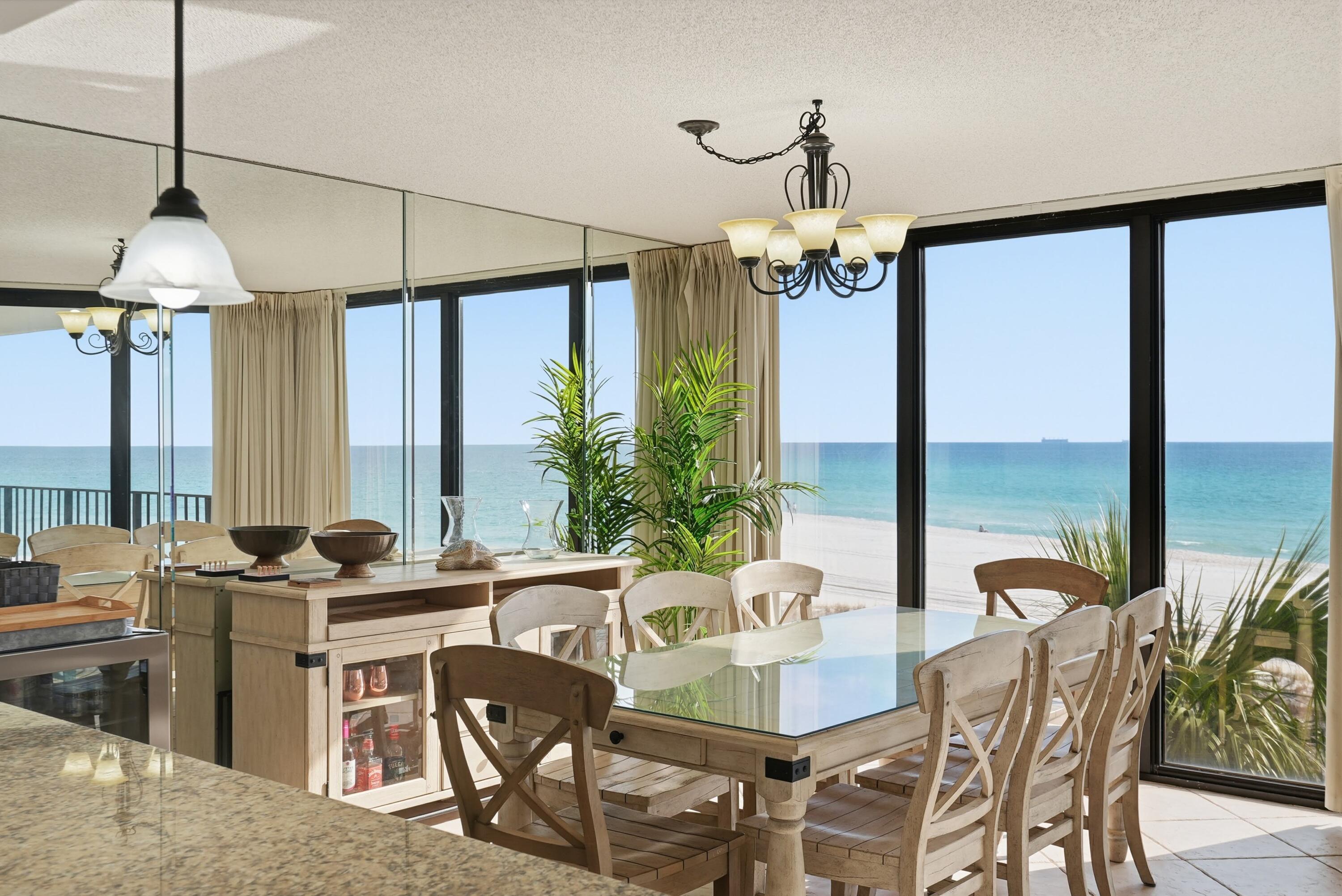 11619 Front Beach Road, Unit 212 Panama City Beach, FL 32407 - Photo 3 of 63 a dining room with furniture water view and a chandelier