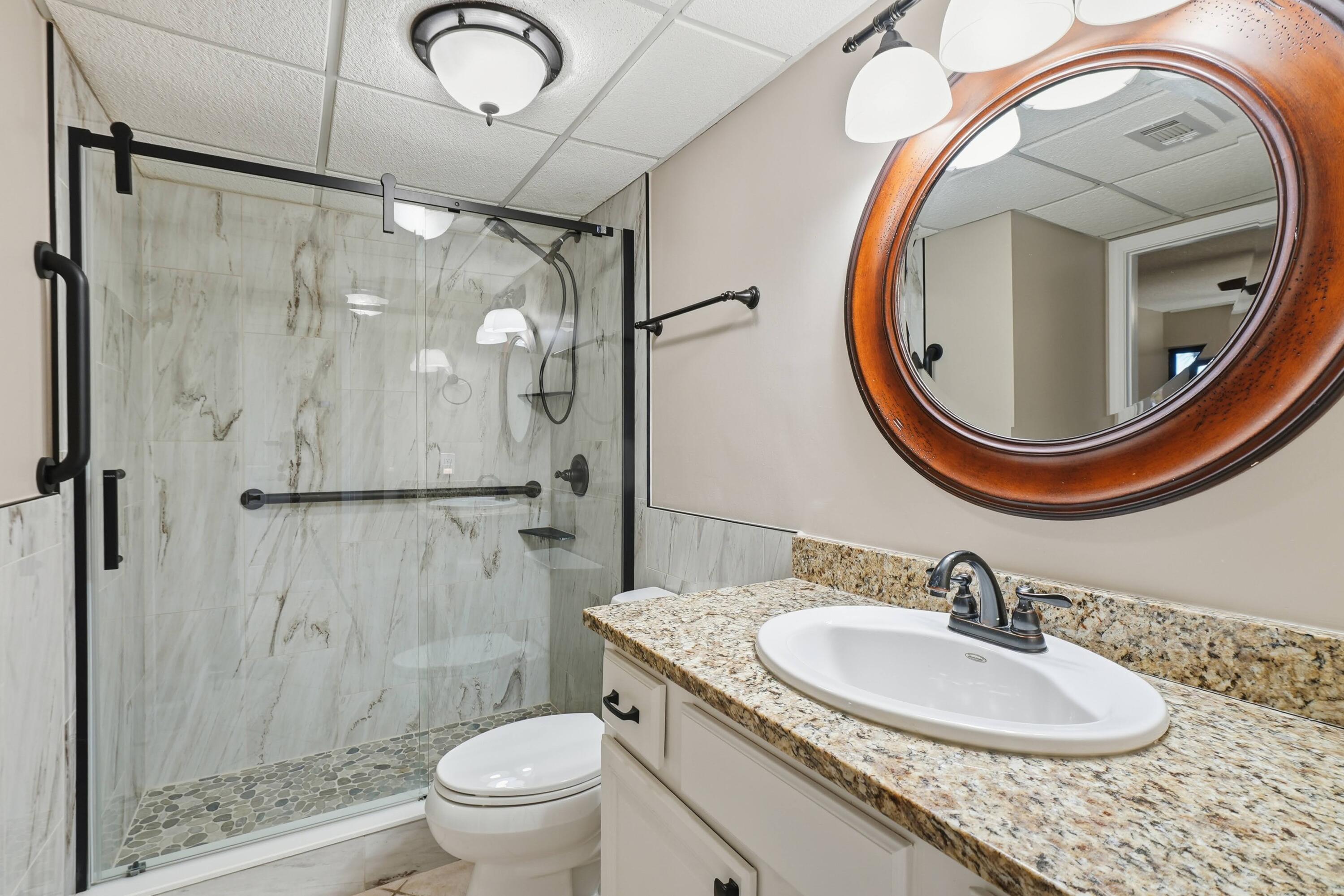 11619 Front Beach Road, Unit 212 Panama City Beach, FL 32407 - Photo 33 of 63 a bathroom with a sink and a mirror