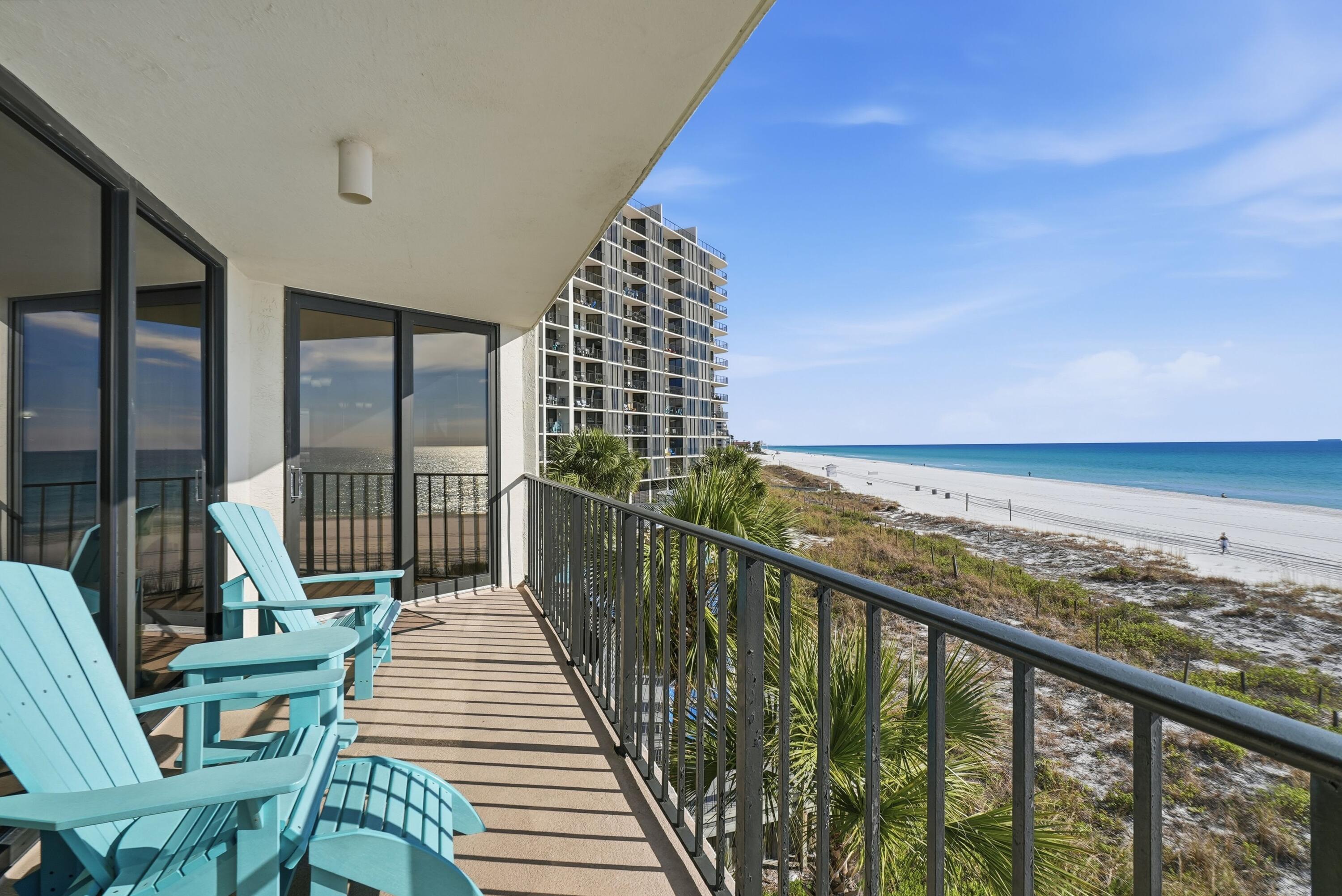 11619 Front Beach Road, Unit 212 Panama City Beach, FL 32407 - Photo 36 of 63 a balcony with wooden floor and city view