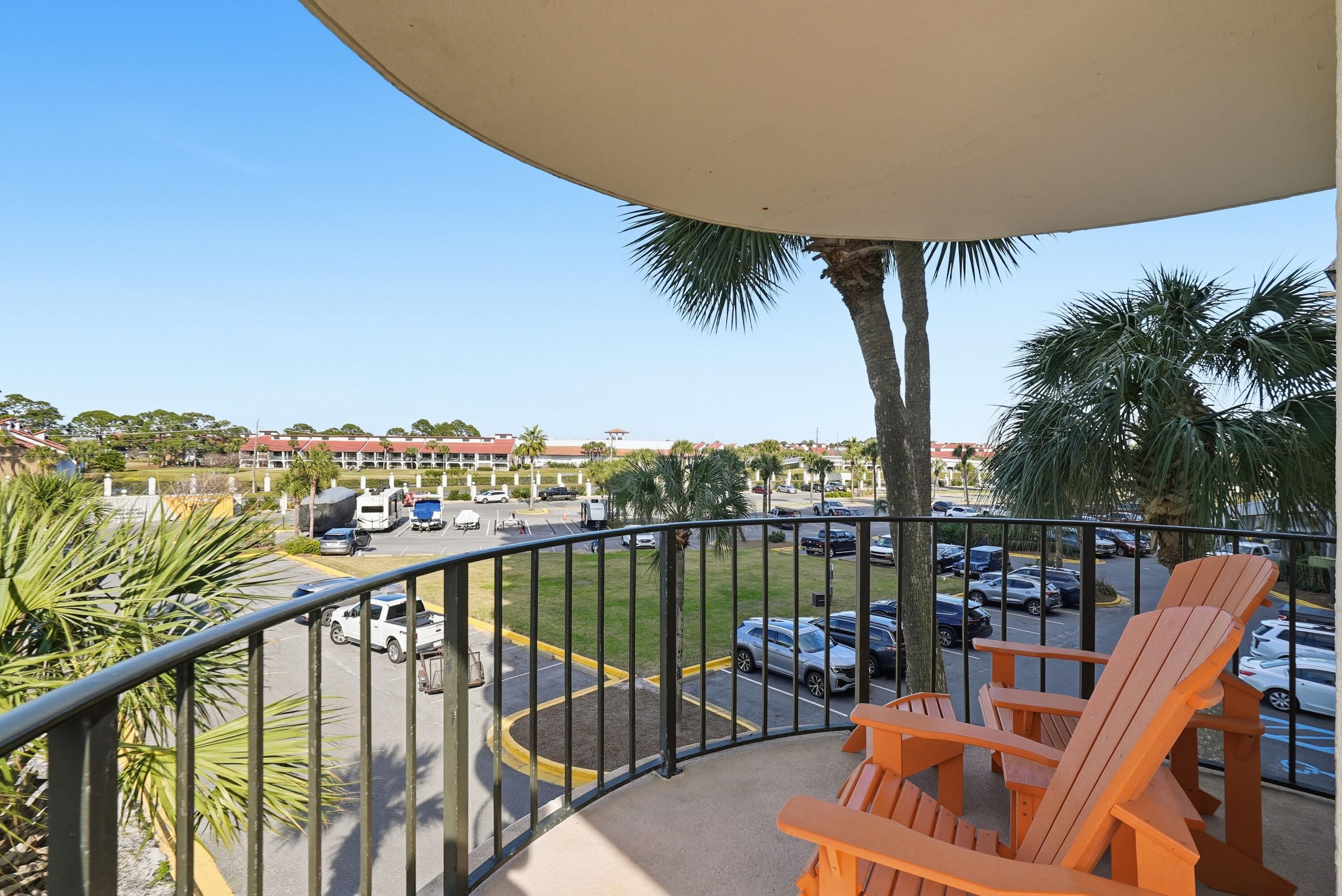 11619 Front Beach Road, Unit 212 Panama City Beach, FL 32407 - Photo 39 of 63 a balcony with outdoor seating