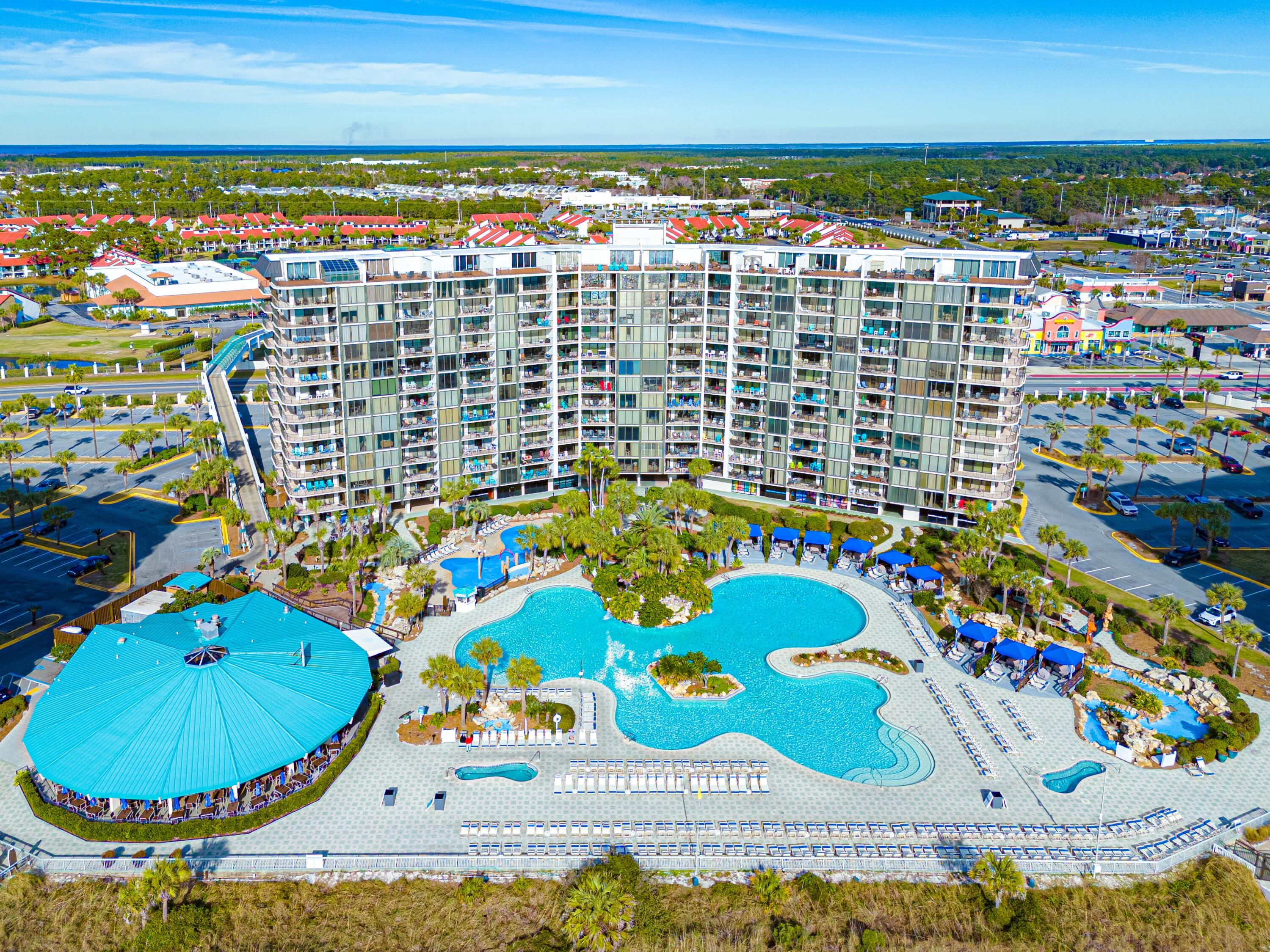 11619 Front Beach Road, Unit 212 Panama City Beach, FL 32407 - Photo 42 of 63 a view of swimming pool with outdoor seating