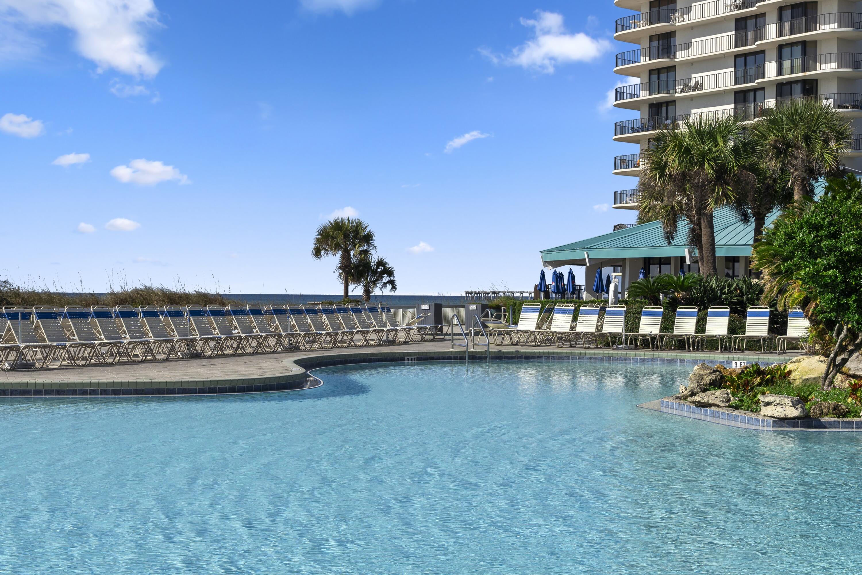 11619 Front Beach Road, Unit 212 Panama City Beach, FL 32407 - Photo 44 of 63 a view of a chair and table in the terrace