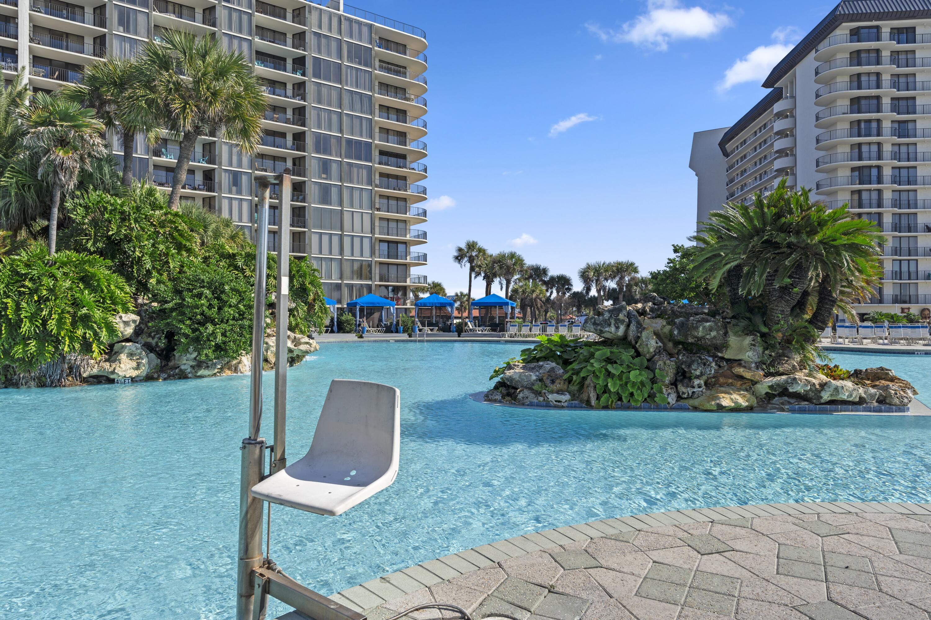 11619 Front Beach Road, Unit 212 Panama City Beach, FL 32407 - Photo 45 of 63 a view of a patio with plants and garden