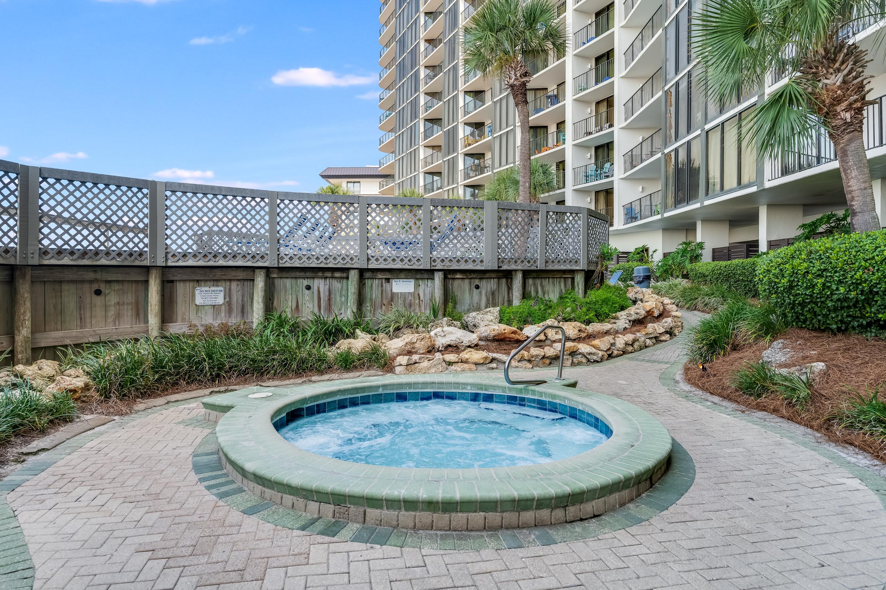 11619 Front Beach Road, Unit 212 Panama City Beach, FL 32407 - Photo 47 of 63 a view of a house with a fountain and sitting area