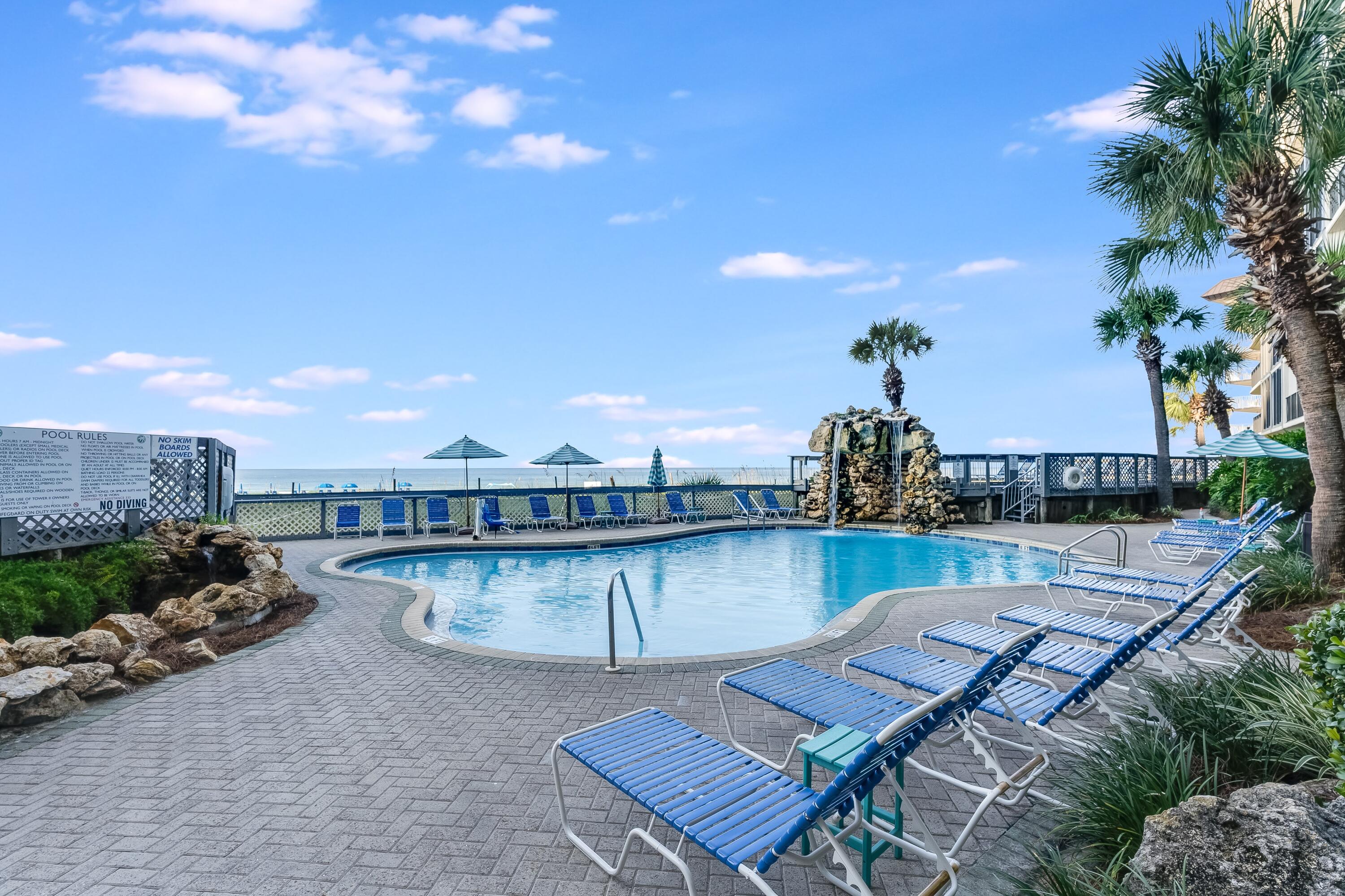 11619 Front Beach Road, Unit 212 Panama City Beach, FL 32407 - Photo 50 of 63 a view of a terrace with outdoor seating and city view
