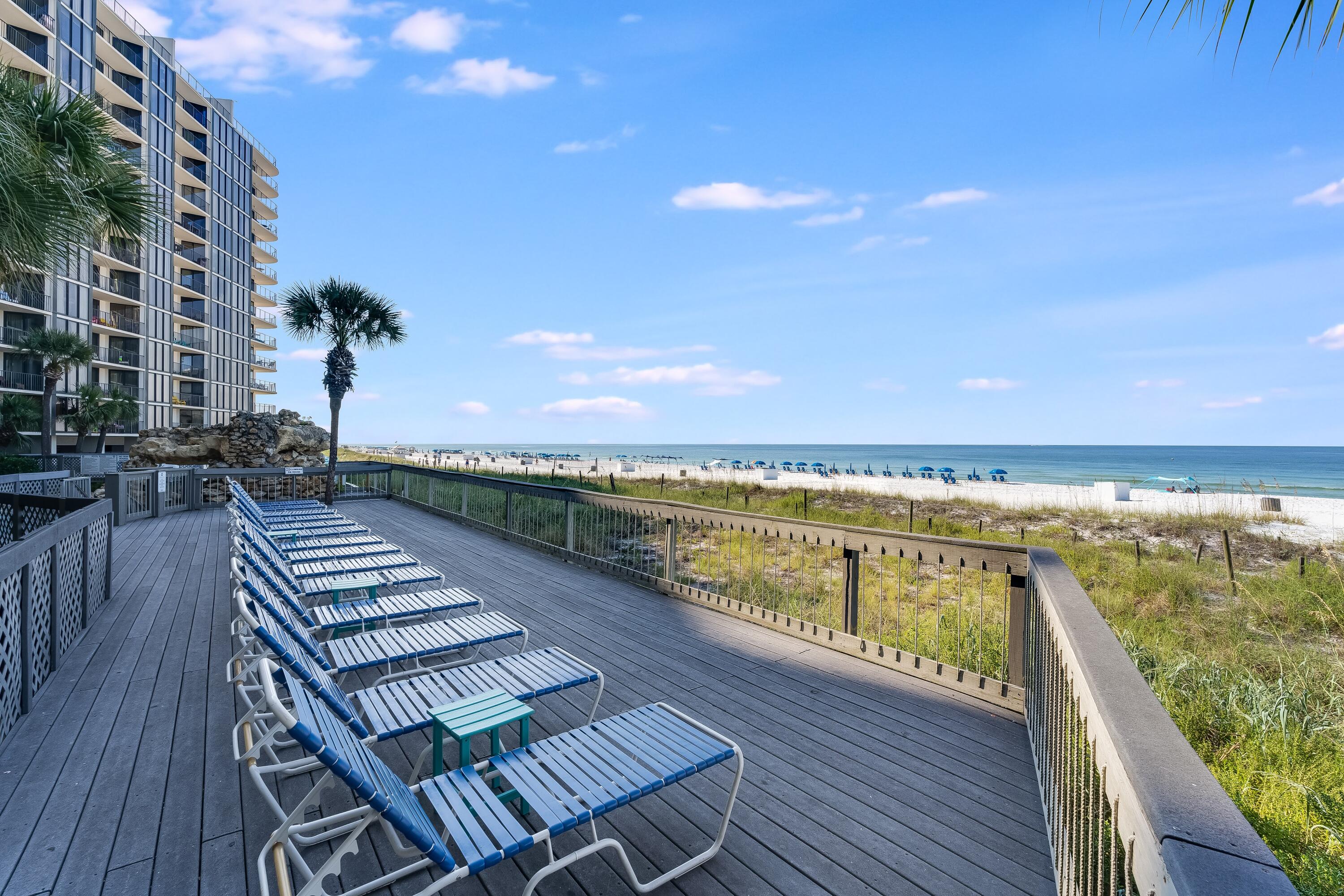 11619 Front Beach Road, Unit 212 Panama City Beach, FL 32407 - Photo 51 of 63 a view of a balcony with wooden floor and city view
