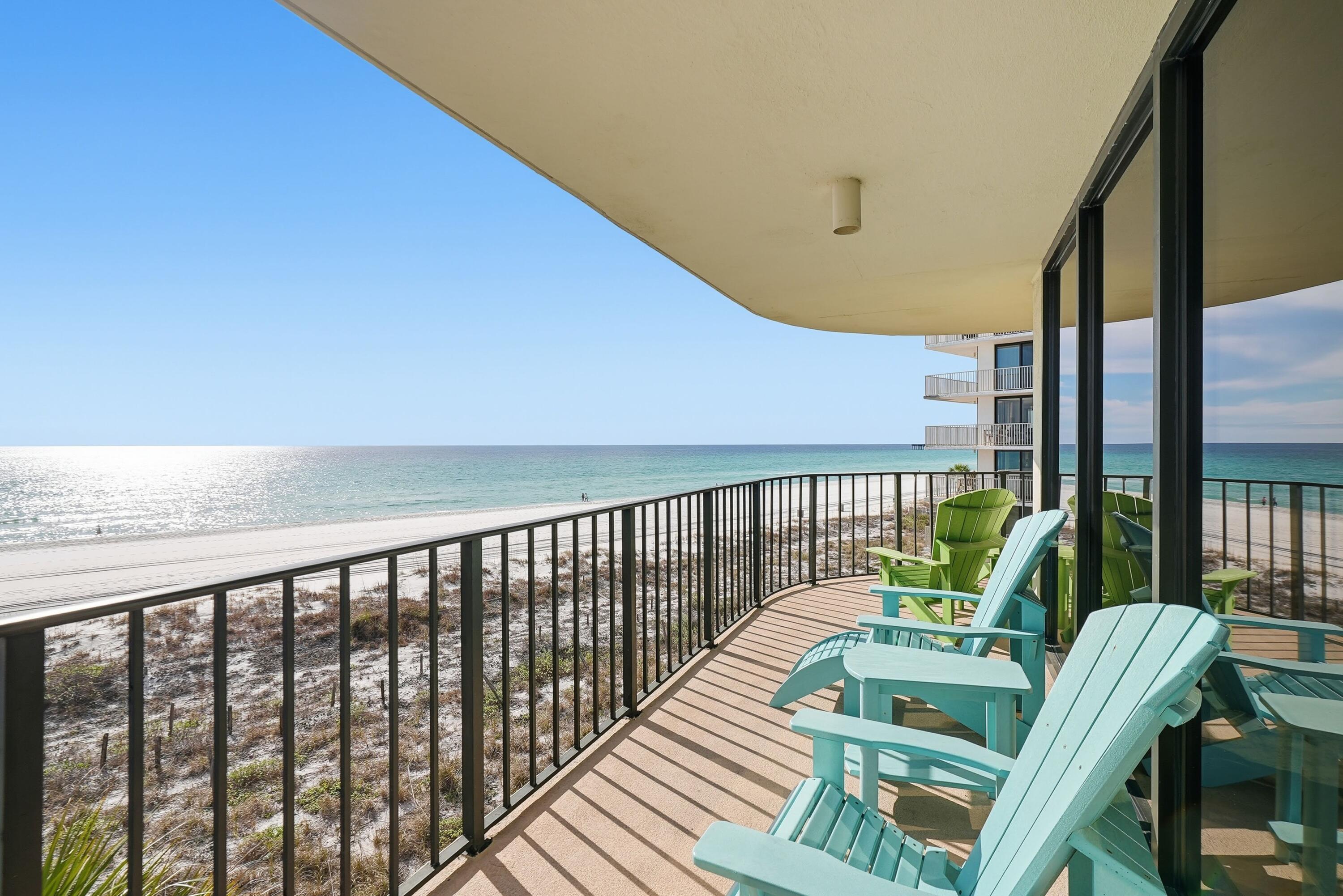 11619 Front Beach Road, Unit 212 Panama City Beach, FL 32407 - Photo 7 of 63 a view of balcony with wooden floor and outdoor seating