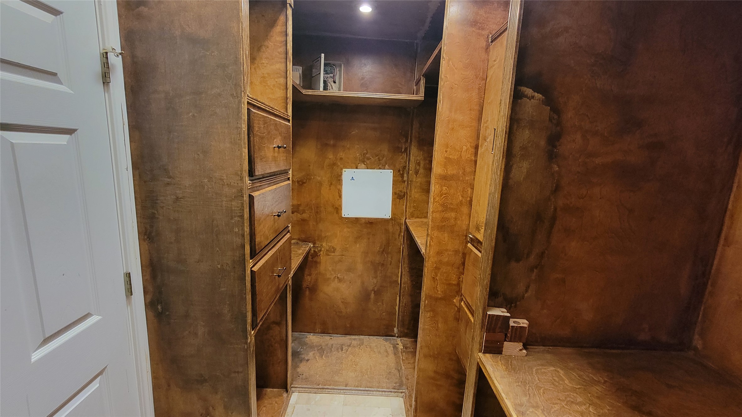 2832 Grimes Ranch Road Austin, TX 78732 - Photo 29 of 37 Ample built-in storage and shelving create a functional and organized walk-in closet.