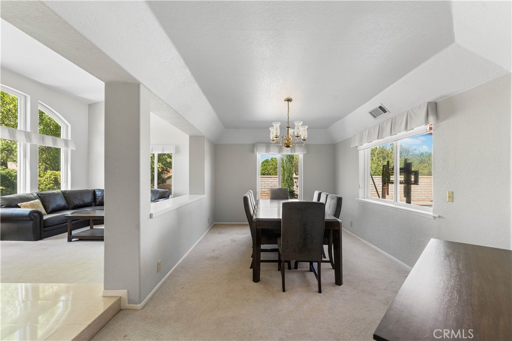 41058 Carmel Road Palmdale, CA 93551 - Photo 15 of 68 a view of a dining room with furniture window and outside view