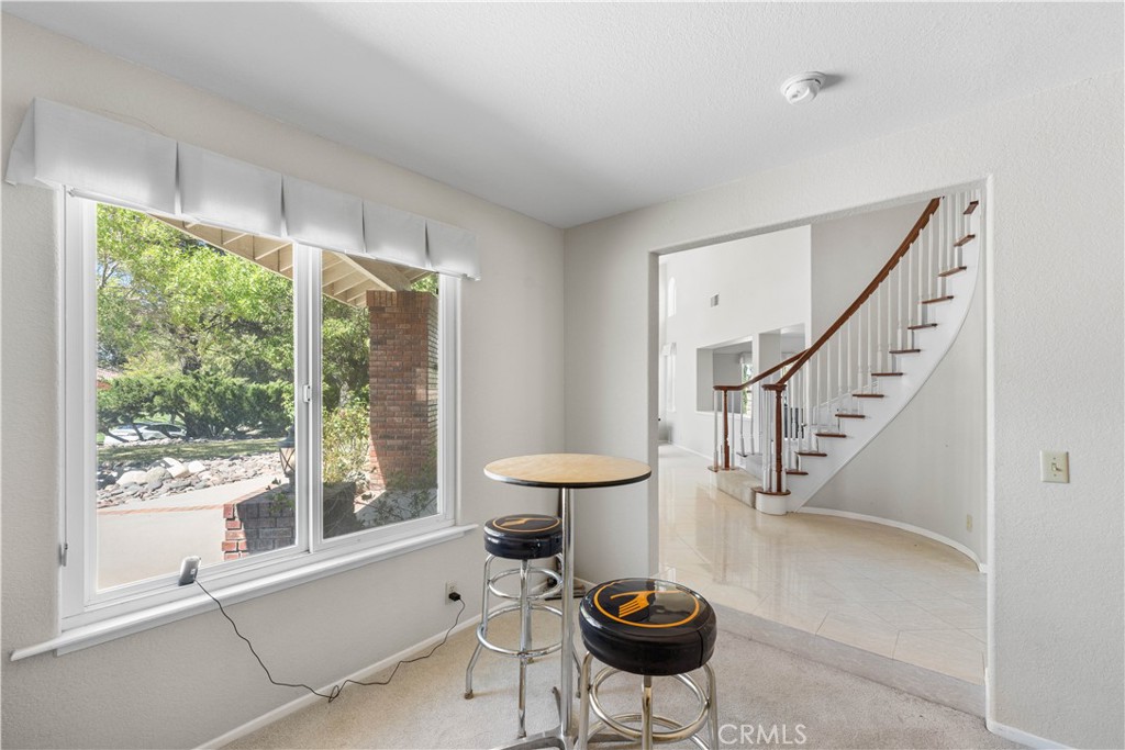 41058 Carmel Road Palmdale, CA 93551 - Photo 26 of 68 a view of a livingroom with furniture and a floor to ceiling window