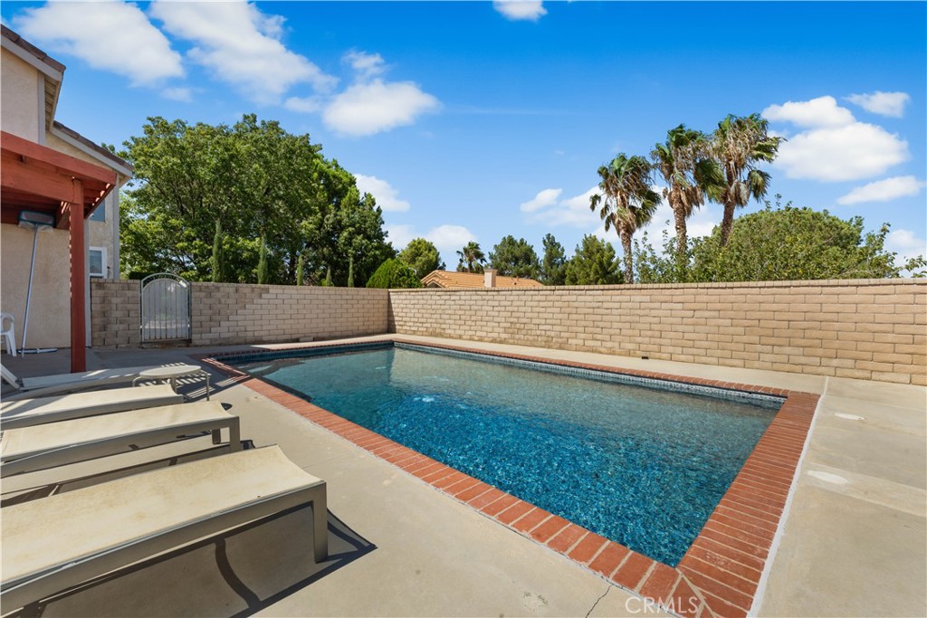 41058 Carmel Road Palmdale, CA 93551 - Photo 49 of 68 a view of a swimming pool with a lake view