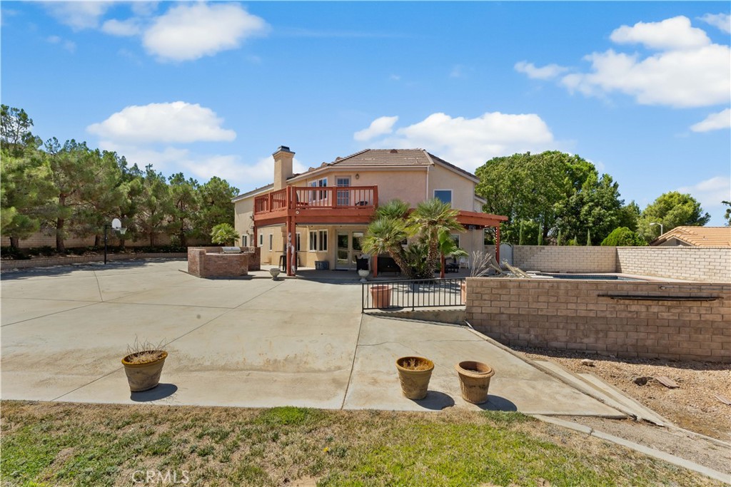 41058 Carmel Road Palmdale, CA 93551 - Photo 58 of 68 a view of a house with a yard and sitting area
