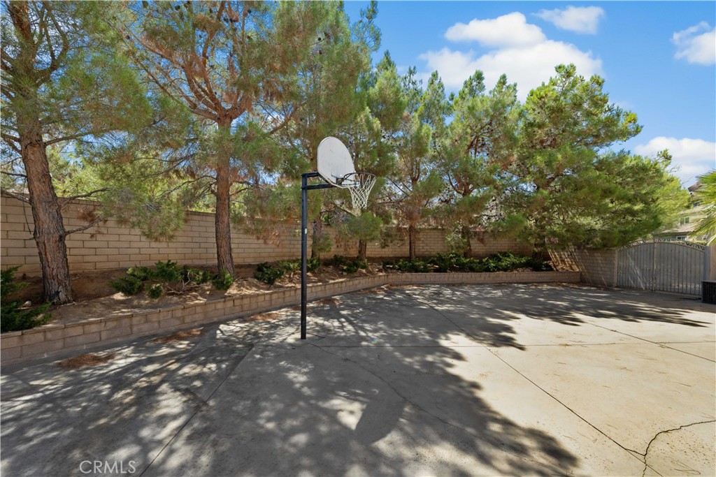41058 Carmel Road Palmdale, CA 93551 - Photo 61 of 68 a backyard of a house with table and chairs