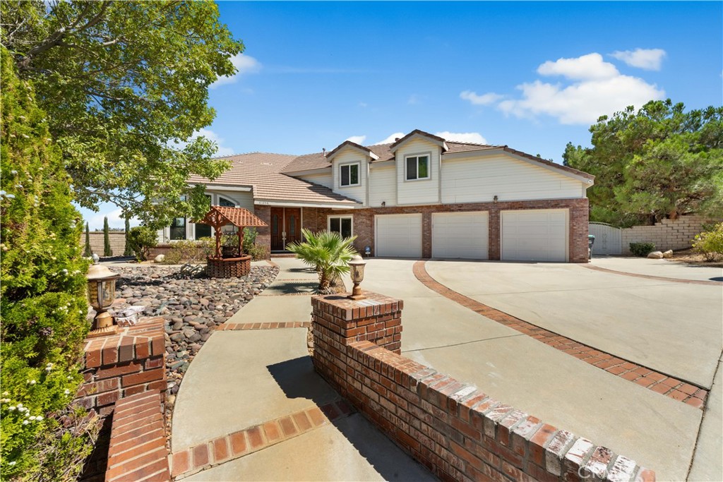 41058 Carmel Road Palmdale, CA 93551 - Photo 7 of 68 a front view of a house with garden