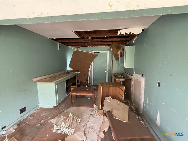 a bedroom with bed and a window