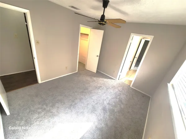 a view of a hallway with windows